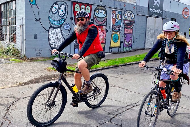 Bike Around Portland Oregon: Art, Culture, Bridges, Poetry - MAX Orange Line street art, Fin DAC murals, and wordplay on concrete